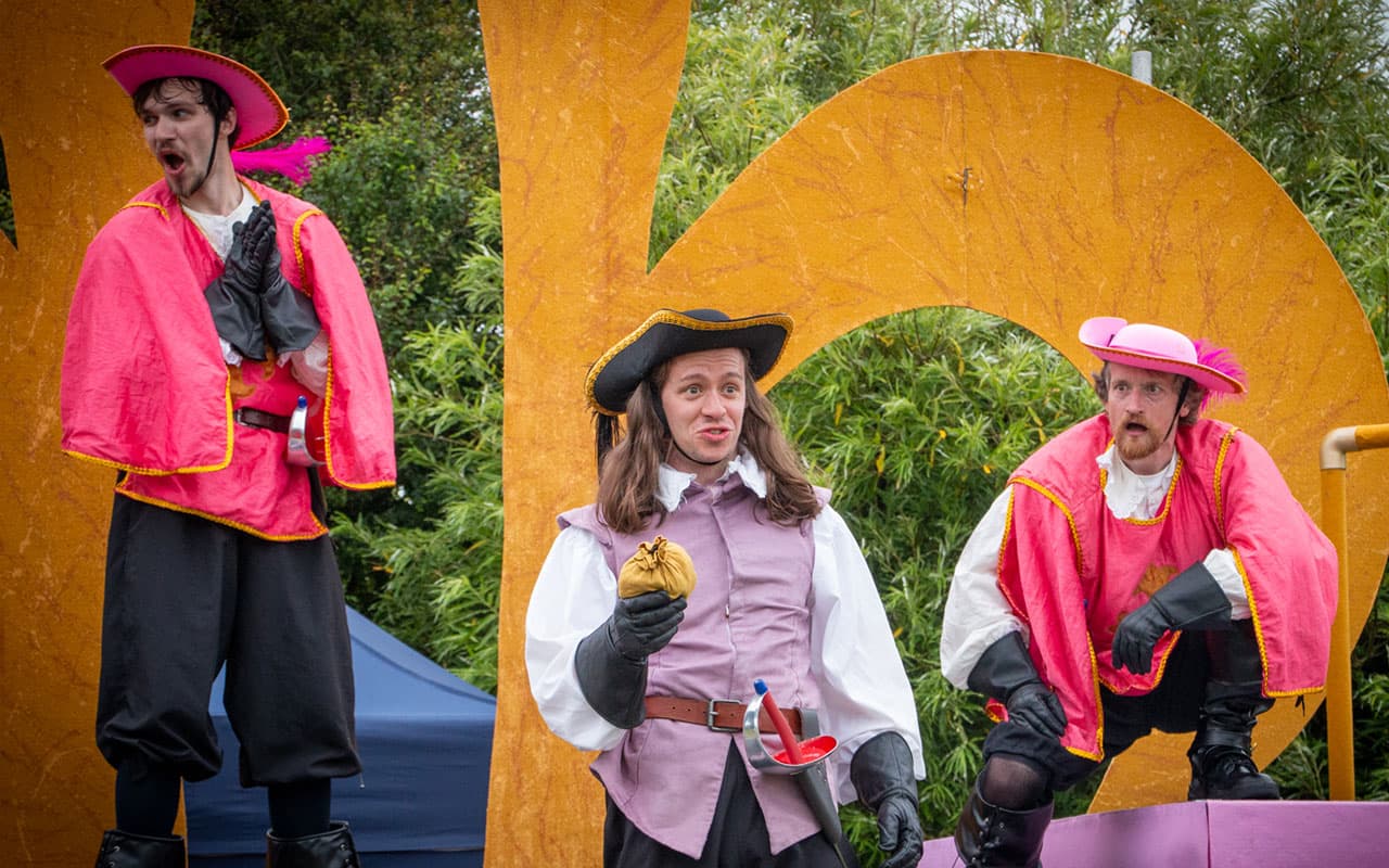 Illyria outdoor theatre production of the Three Musketeers four actors in costume on stage